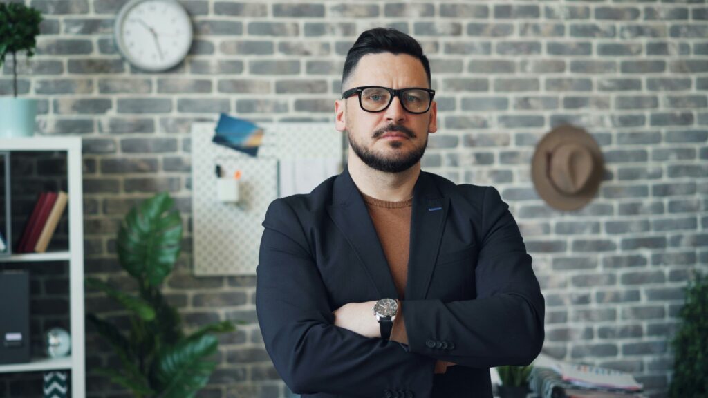 For Employees: 5 helpful reasons for why you should speak to a lawyer before participating in a workplace investigation. 1 Business man looking serious.