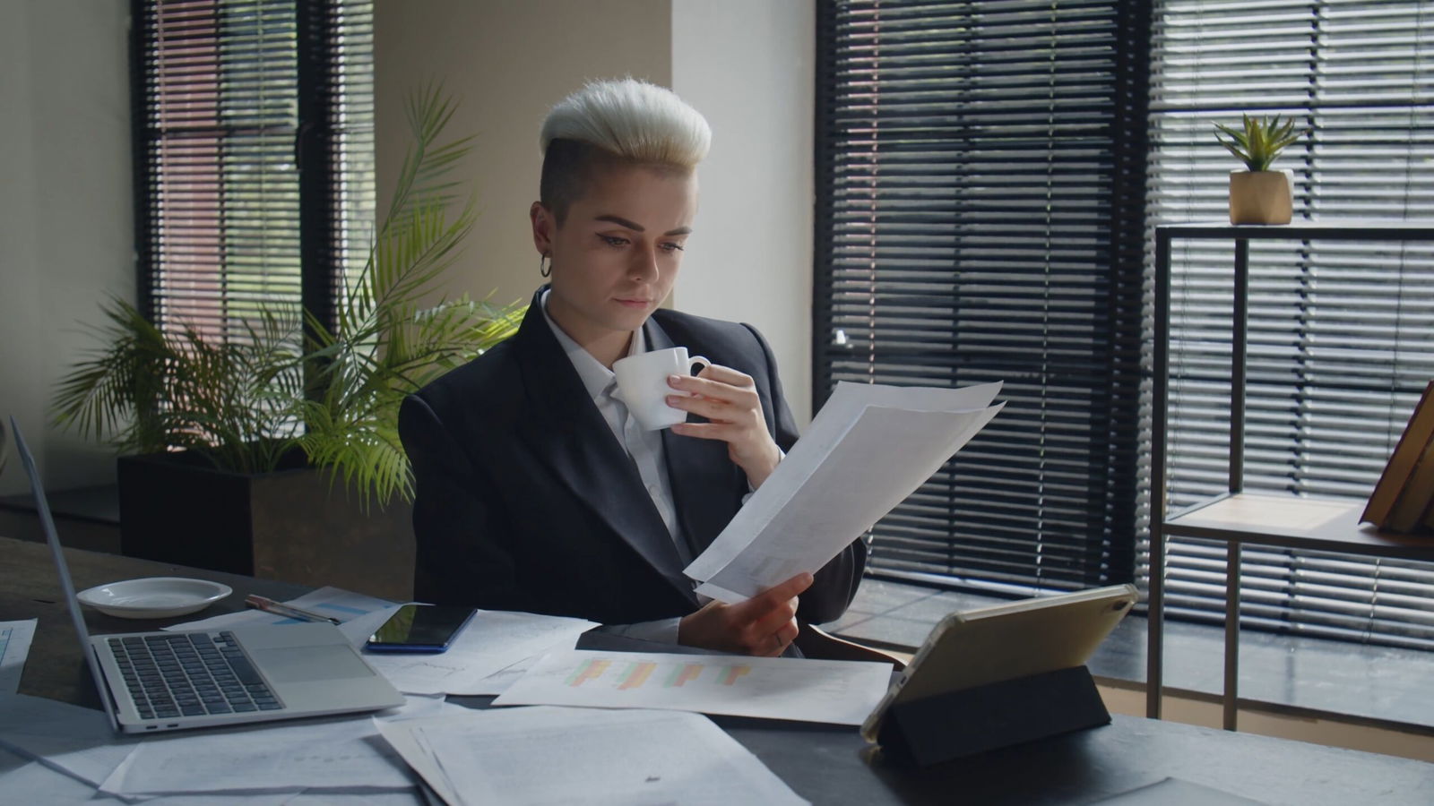 Building a Fair Workplace Investigation Process: Best Practices for Employers 4 03 business woman count finance investment risks and put information into notebook con SBV 348743818 4K 00.00.06.858 scaled