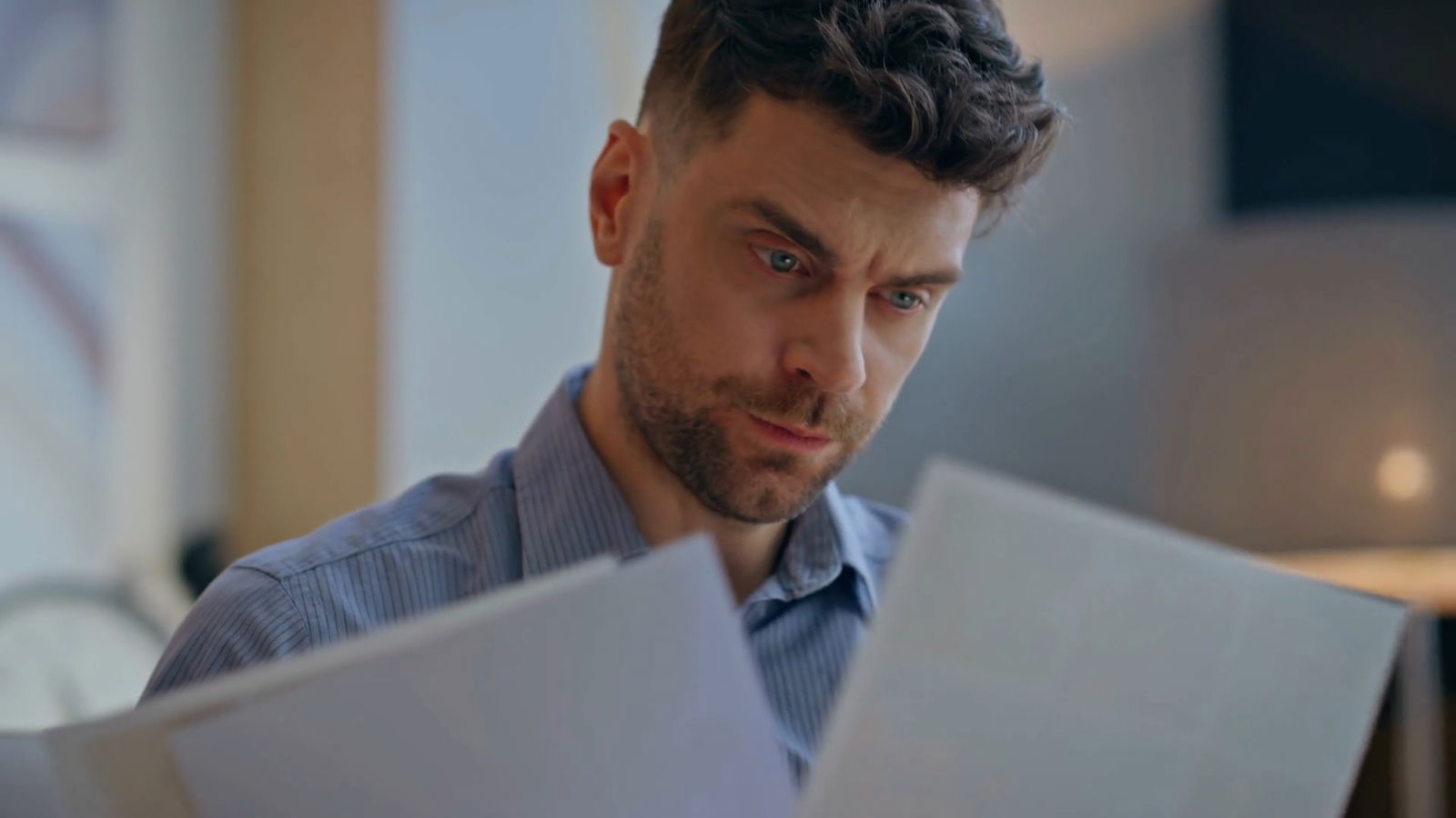 Accused of Benefits Fraud? 6 Things You Need To Know 3 Employee reviewing and comparing two papers