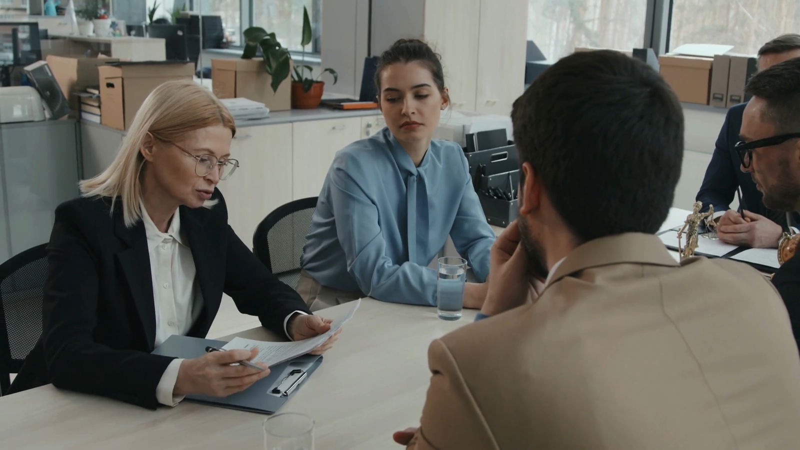 Accused of Benefits Fraud? 6 Things You Need To Know 6 Lawyer team meeting with board members of an organization