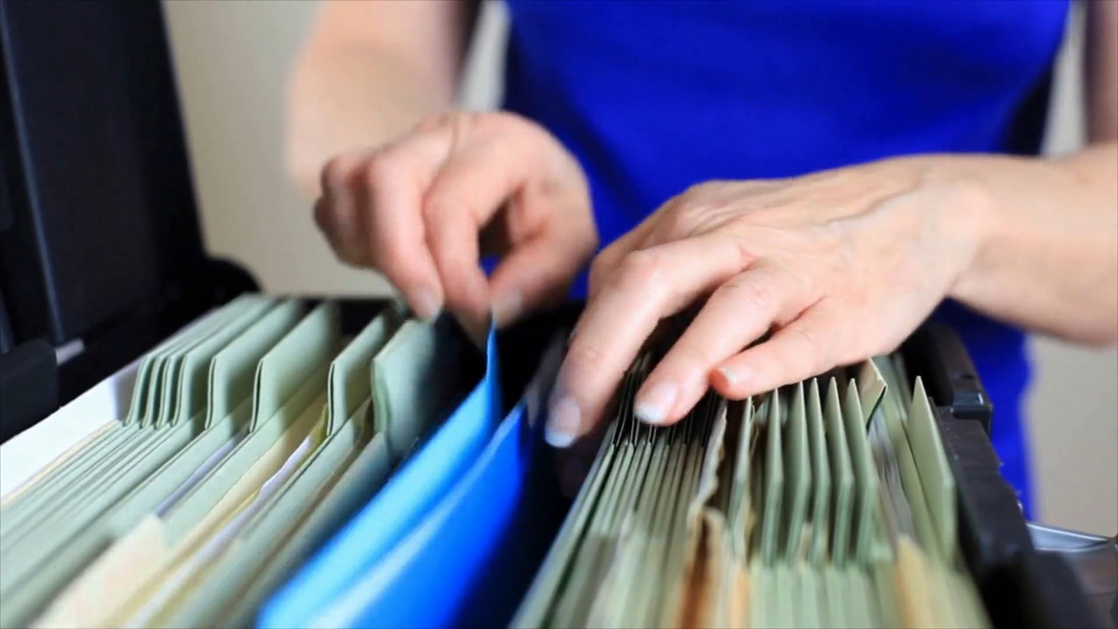 Accused of Benefits Fraud? 6 Things You Need To Know 7 An employee filing papers and reviewing information