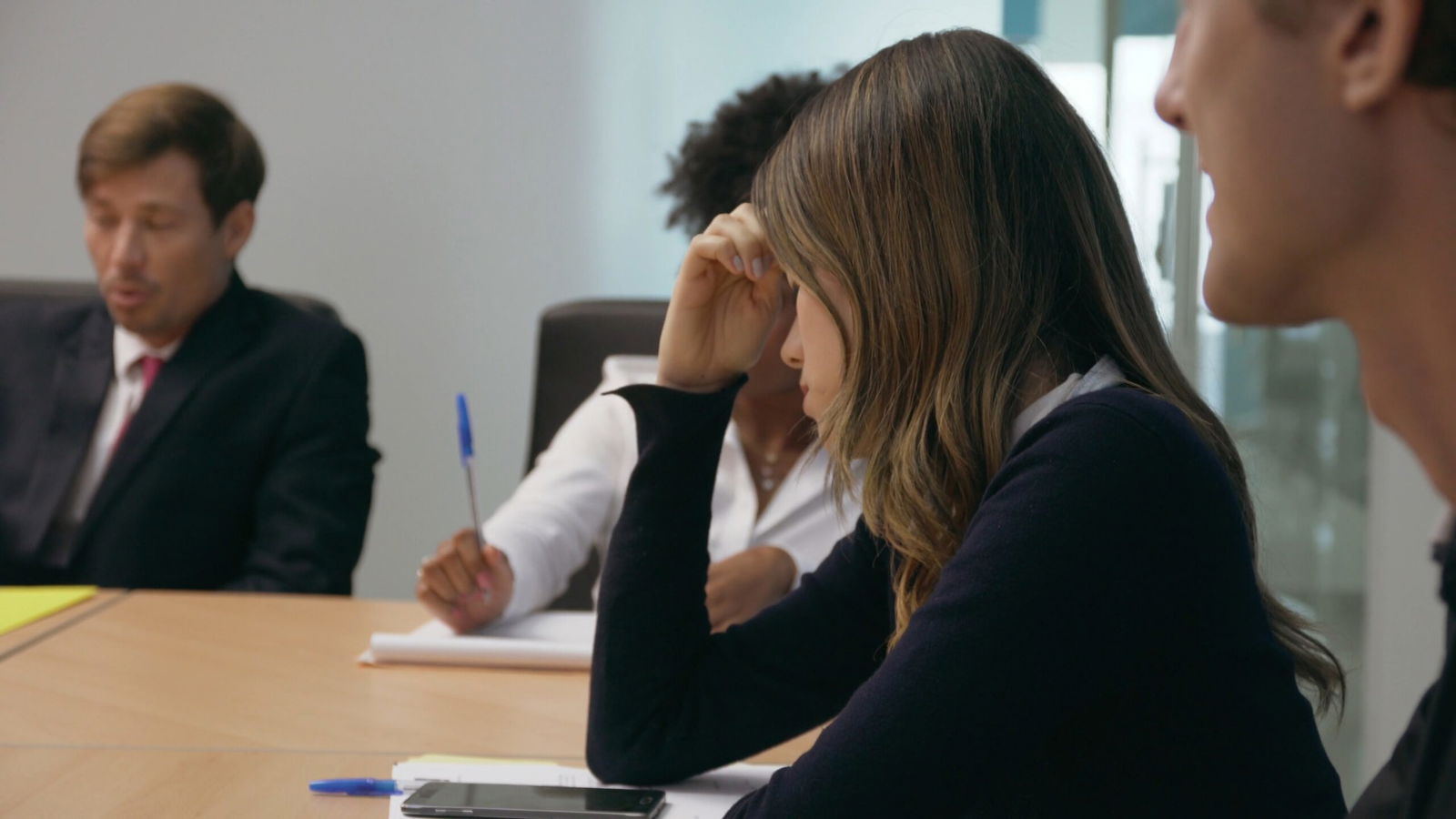 Are You Worried Your Trauma Makes You Look Unreliable in a Legal Investigation? 3 Employee in meeting appearing emotional or withdrawn